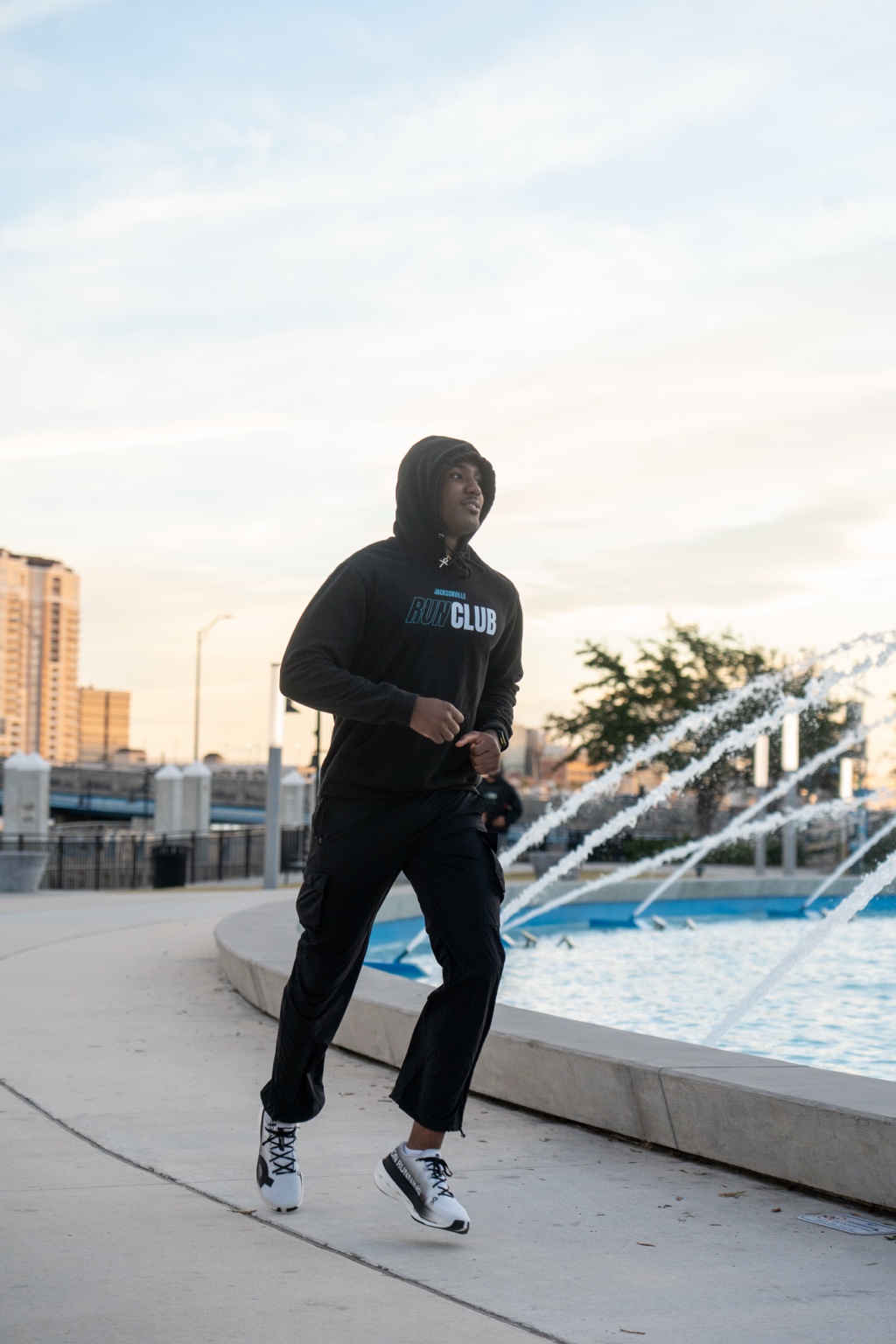 Jaylen Fowler running beside Friendship Fountain in Jacksonville